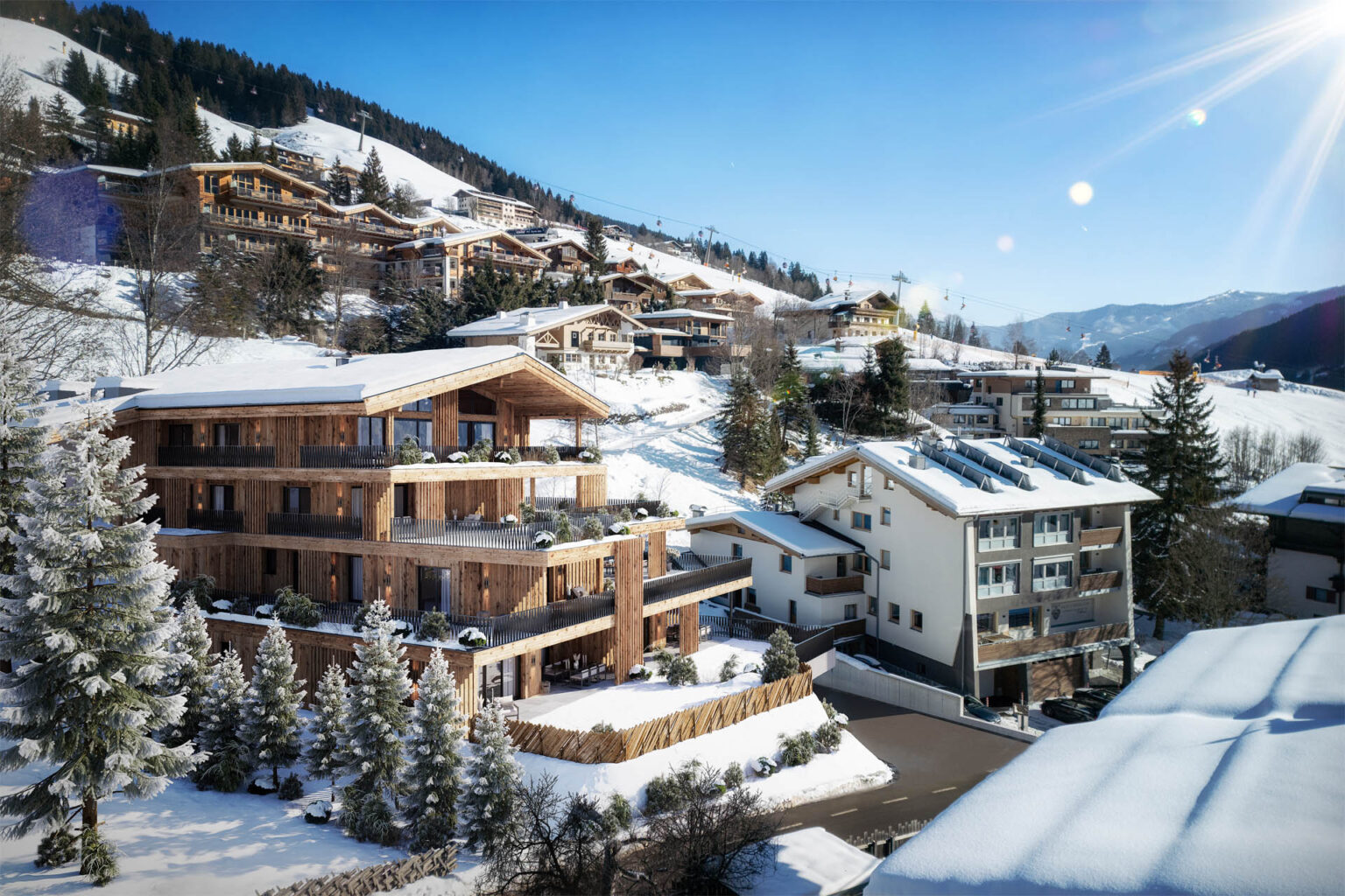 3D-Visualisierung eines exklusiven Chalets in Saalbach-Hinterglemm mit großzügigen Terrassen und Blick auf die Skipiste